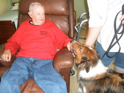 Sully the therapy dog with resident