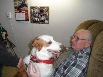 Male Residents with a brown and white dog